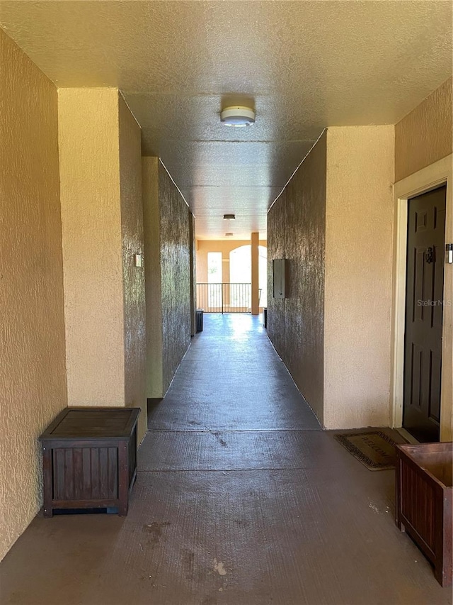 hallway with hardwood / wood-style flooring