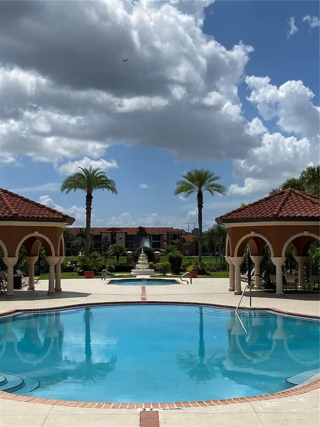 view of pool with a gazebo and a patio area