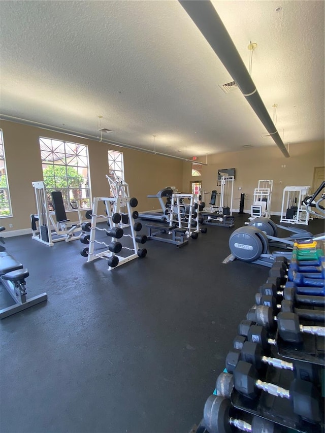 workout area featuring a textured ceiling