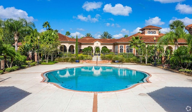 view of swimming pool with a patio