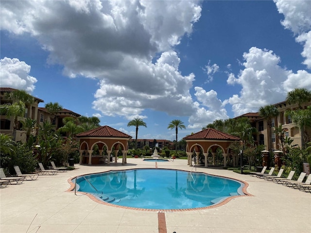 view of pool featuring a gazebo and a patio area