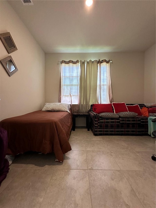 bedroom with tile flooring