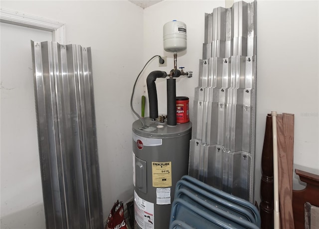 utility room featuring electric water heater