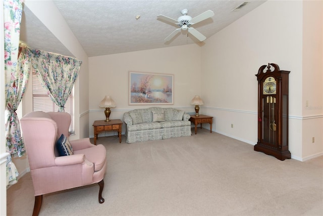 sitting room featuring carpet, ceiling fan, and lofted ceiling