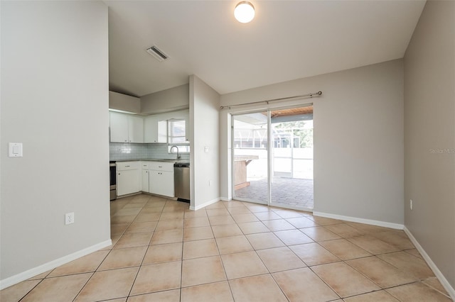 interior space featuring sink and light tile flooring