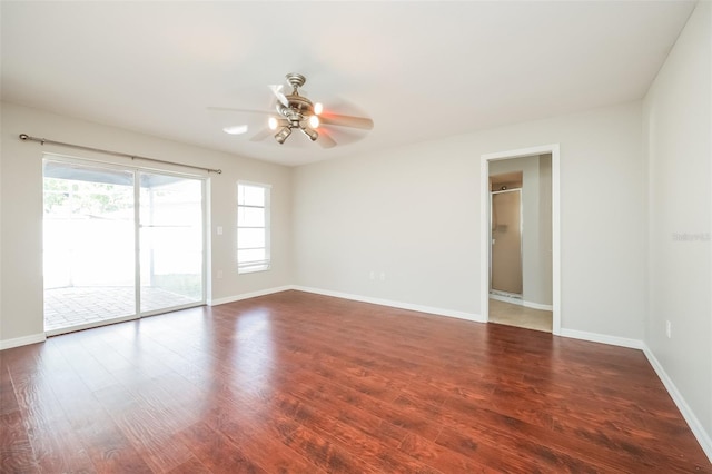 empty room featuring wood-type flooring and ceiling fan