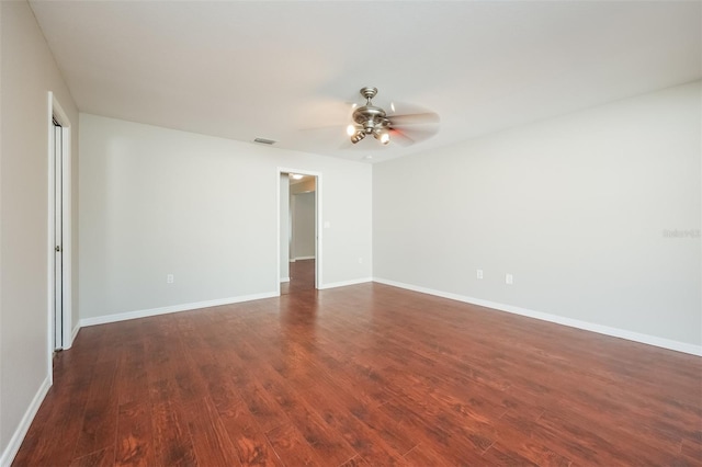 empty room with ceiling fan and hardwood / wood-style floors