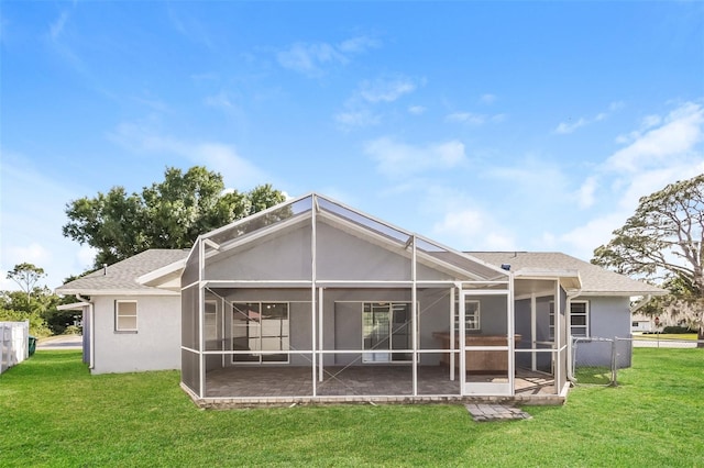 rear view of house with a patio area and a lawn