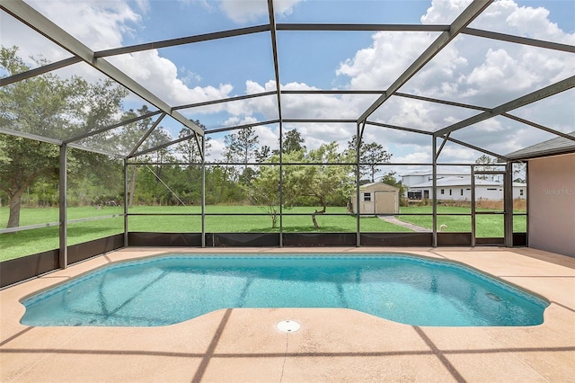 view of pool featuring a patio, a lanai, a yard, and a shed