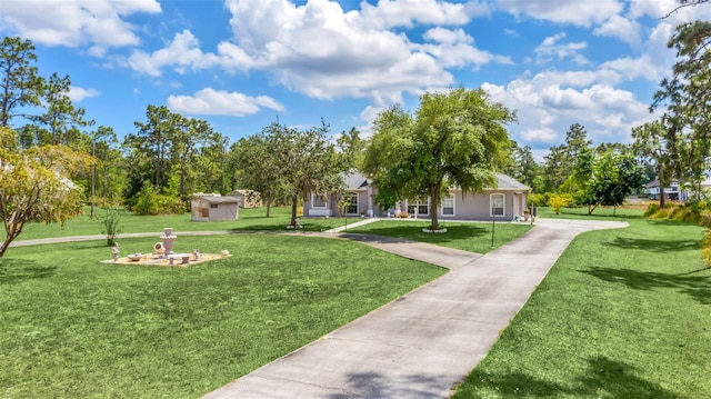 view of property's community with a lawn