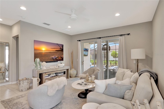 tiled living room with ceiling fan