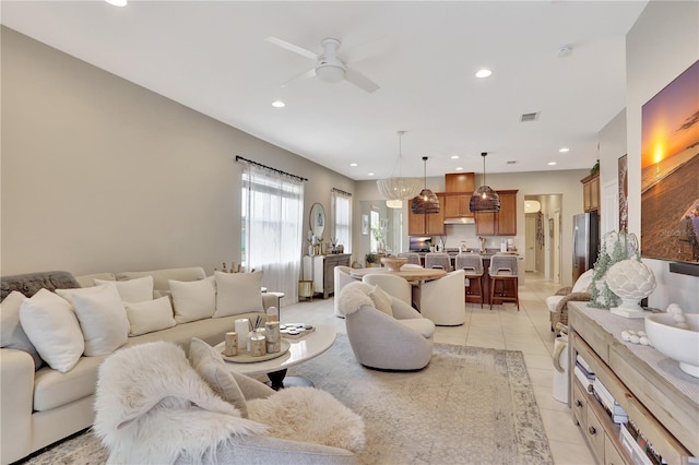 tiled living room featuring ceiling fan