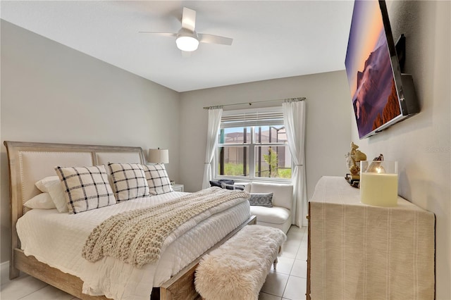 tiled bedroom featuring ceiling fan