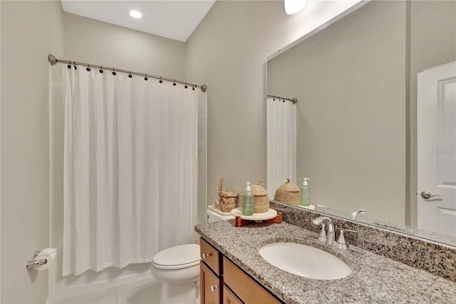 bathroom featuring oversized vanity, toilet, and tile floors