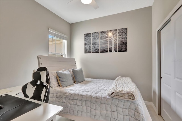 bedroom with ceiling fan and a closet