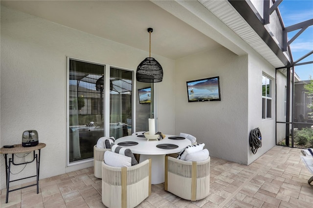 view of patio / terrace with a lanai