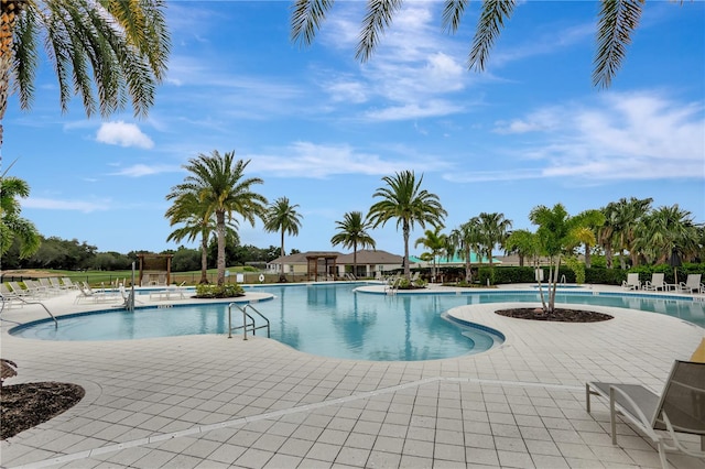 view of swimming pool featuring a patio area