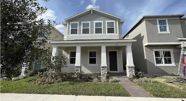 view of front of property featuring covered porch