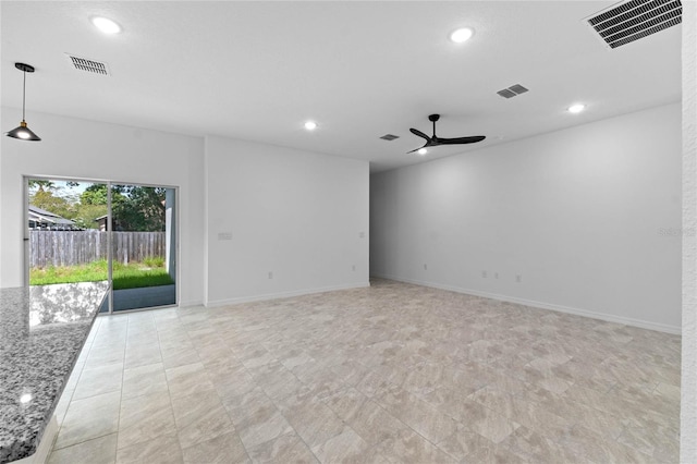 unfurnished room featuring ceiling fan