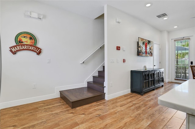 staircase featuring light hardwood / wood-style flooring