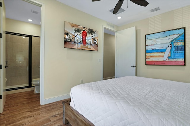 bedroom featuring wood-type flooring, connected bathroom, and ceiling fan