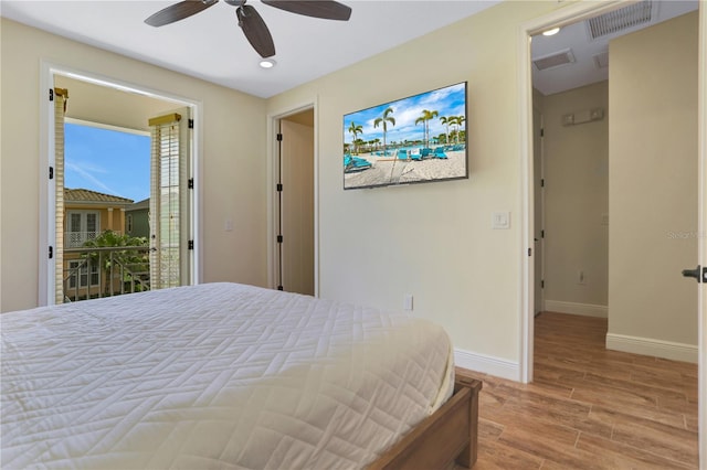 bedroom featuring hardwood / wood-style flooring, ceiling fan, and access to exterior