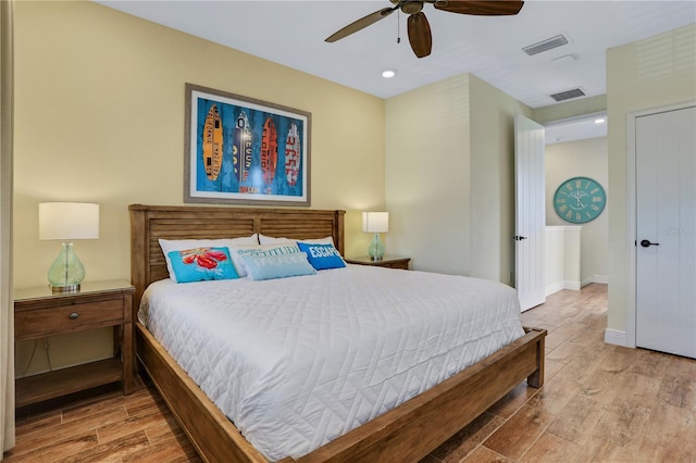 bedroom with wood-type flooring and ceiling fan