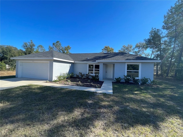 ranch-style house with a garage and a front yard