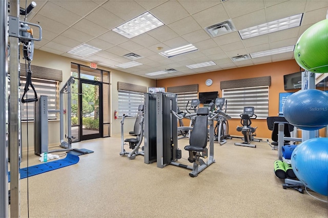 gym featuring a paneled ceiling