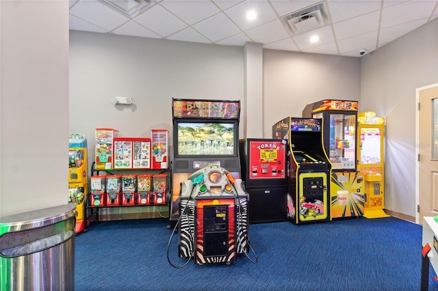 playroom with a drop ceiling and carpet floors