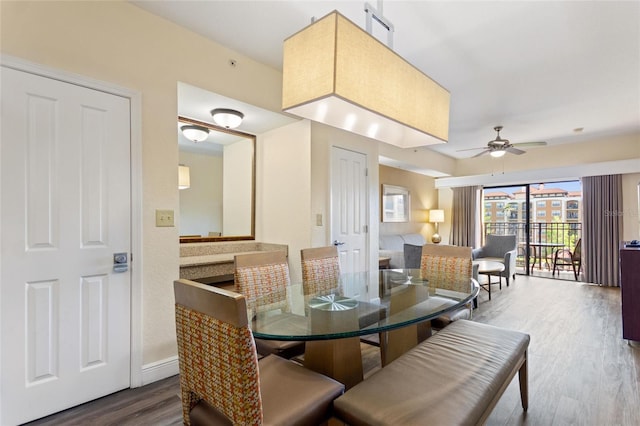 dining room featuring hardwood / wood-style floors and ceiling fan