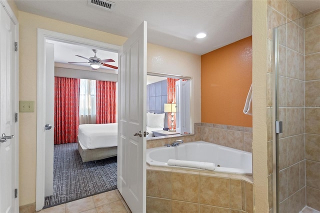 bathroom featuring ceiling fan, tile patterned floors, and independent shower and bath