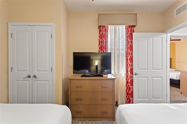 bedroom featuring a closet and carpet flooring