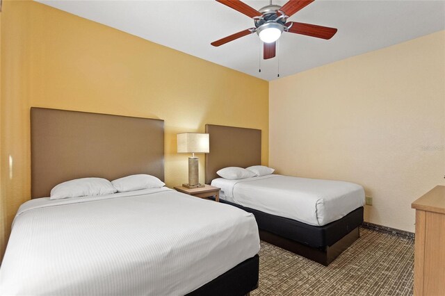 bedroom featuring ceiling fan and carpet flooring