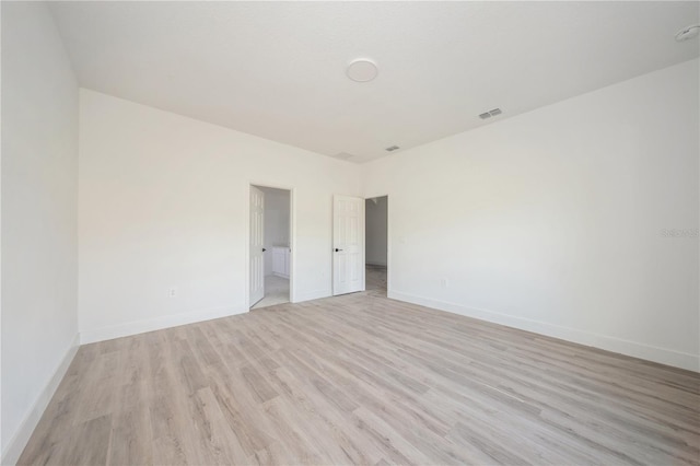 unfurnished room with light hardwood / wood-style flooring