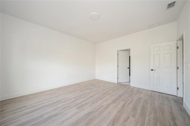 unfurnished room featuring light hardwood / wood-style flooring