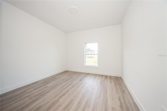 empty room with light hardwood / wood-style floors