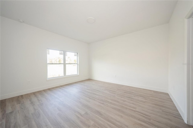 spare room featuring light wood-type flooring