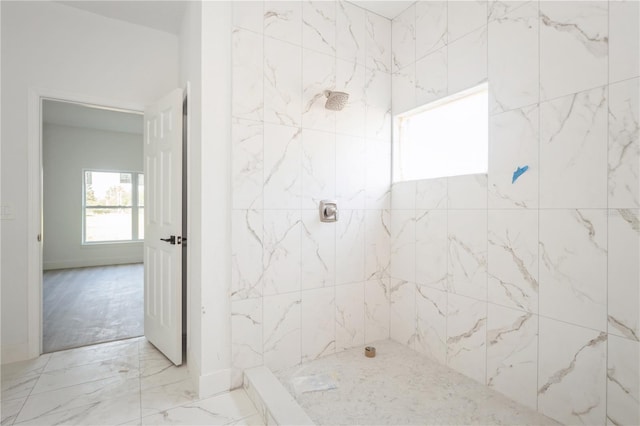 bathroom featuring a tile shower