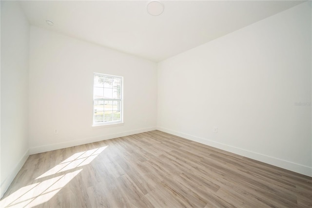 unfurnished room featuring light hardwood / wood-style floors