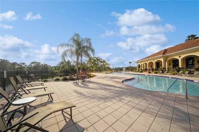 view of swimming pool with a patio