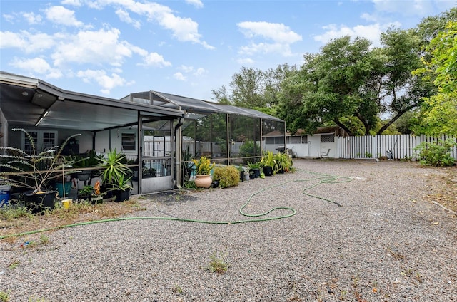 view of yard with a lanai