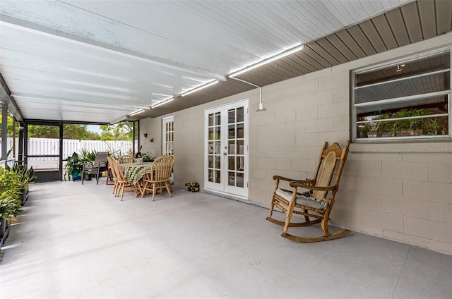 unfurnished sunroom featuring french doors