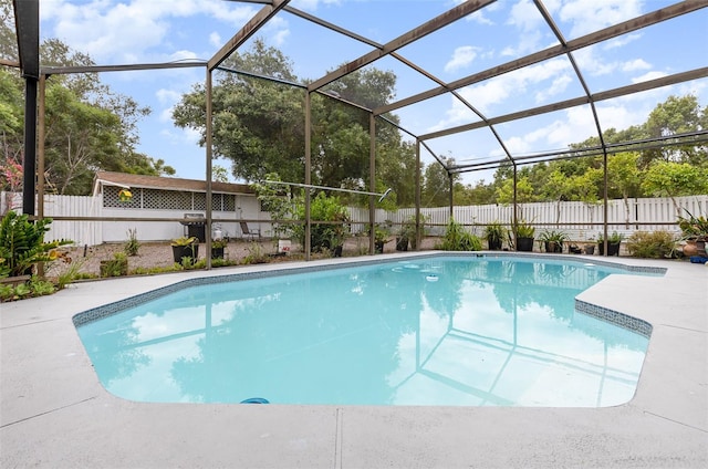 view of swimming pool with a lanai