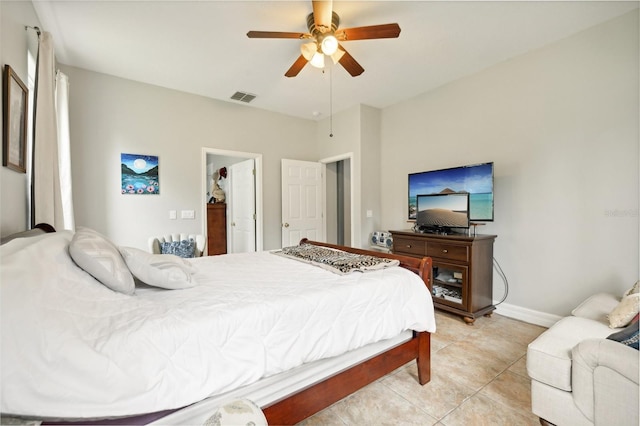 tiled bedroom featuring ceiling fan