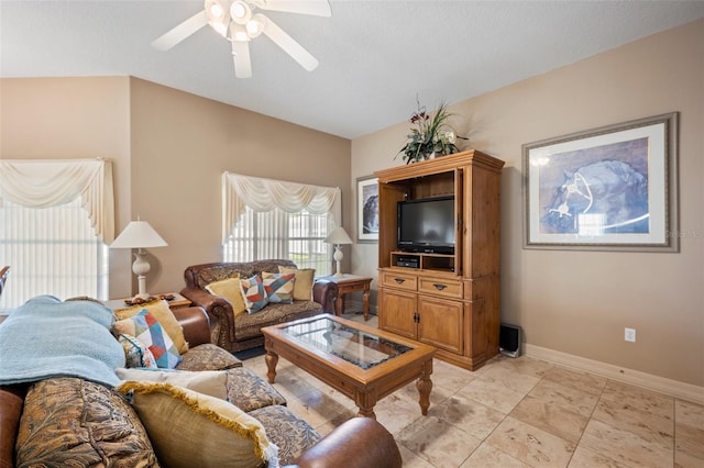 tiled living room featuring ceiling fan