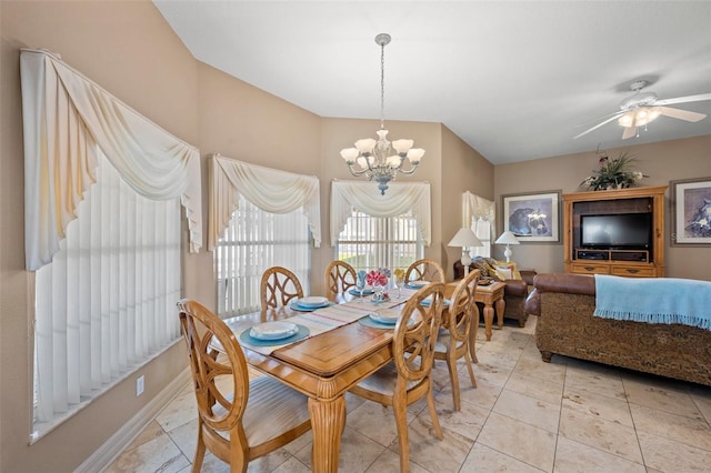 dining area featuring ceiling fan with notable chandelier and light tile patterned floors