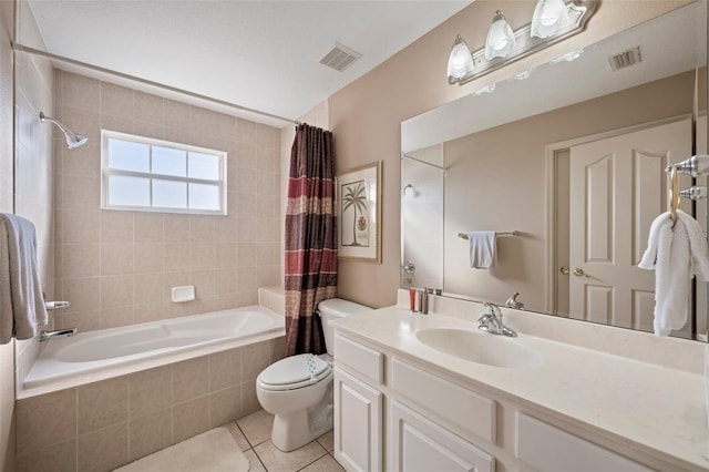 full bathroom with tile patterned flooring, shower / bathtub combination with curtain, toilet, and vanity