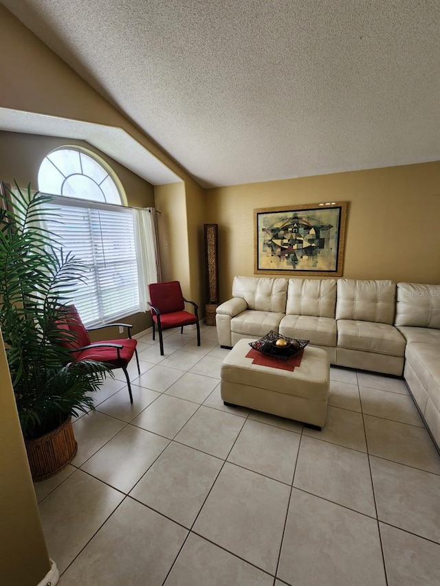 tiled living room with lofted ceiling and a textured ceiling