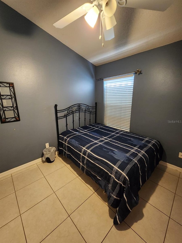 bedroom featuring tile patterned flooring and ceiling fan